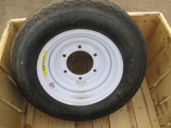 One new Towmaster 22.5x8.0-12 tire and 6 bolt rim with additional 6 bolt rim