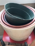 Planting pots in plant stand on wheels