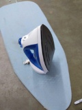 Steam iron with an iron board