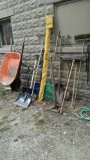 yard tool lot and wheelbarrow
