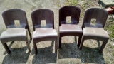 Four plastic yard chairs