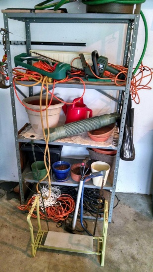 Metal Shelf with yard tools and miscellaneous