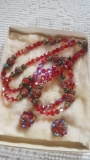 Red beaded necklace with matching earrings
