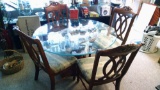 54 inch round glass top table with 4 ornate chairs
