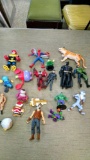 Group of figurines including Batman and Spider-Man