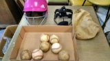 Baseballs and batting helmet