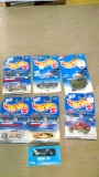 6 Hot Wheels cars on cards