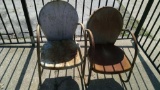 Two vintage metal lawn chairs