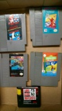 Four Nintendo game cartridges