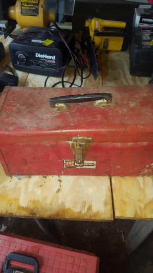 red metal toolbox with tools