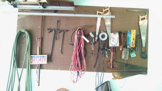 Assorted tool and accessory lot on wall