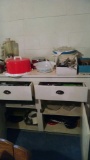 Cabinet contents including flatware, Crock-Pot, blender, cake dish and more