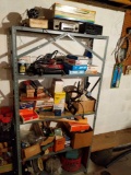 Assortment of autombile parts and accessories in basement