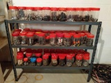 Metal rack of assorted screws, nuts, bolts, washers