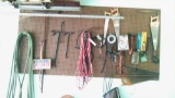 Assorted tool and accessory lot on wall