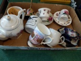 Assortment of decorative teapcup plate sets, coffee mugs, handbell