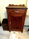 Wooden cabinet, trash can, and scale GARAGE