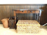 Wooden table, storage basket with contents, and 2 waste baskets