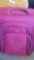 Large pink suitcase