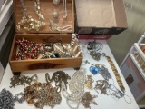 Wood jewelry box full of necklaces