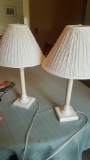 Two matching lamps and metal wall decor