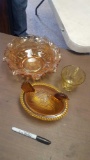 Orange glass dishes and nesting hen