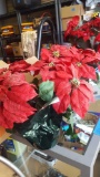 Two artificial red poinsettias