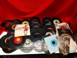 Approximately eighty 45 RPM records