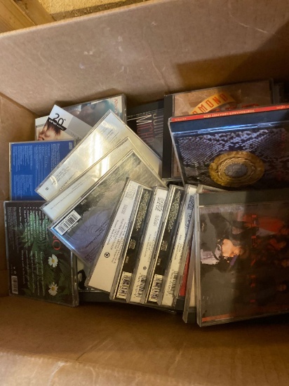 Two boxes of CDs one box of cassettes