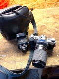 Canon AE -1 camera lens and flash
