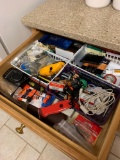 Contents of kitchen junk drawer batteries camera