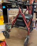 T-Rex four-wheel walker with seat in storage