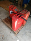 3 gas cans with cart