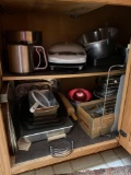 contents in cabinet in kitchen