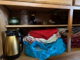 contents in bottom cabinet in dining room