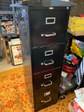 Tall black four drawer filing cabinet