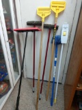 Mop handles, brooms, and dusters
