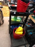 Cleaning cart with supplies and buckets