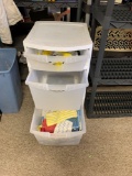 Three drawer plastic storage unit with contents