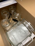 Mason jar water pitcher and four mugs