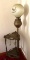 Antique oil lamp on stand