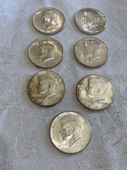 Seven Kennedy half dollars silver 1964