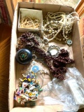 Several boxes of costume jewelry