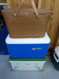 Two Coleman coolers and picnic basket