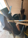 Trashcan full of yard hand tools