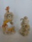 Two 12-in tall ceramic figurines one clock and one musical Santa