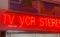 Large neon sign TV VCR stereo