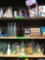 2- shelves of bottle and misc