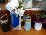 Four craft made decorative jars