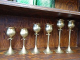 Set of six brass candle holders